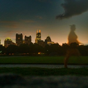 A lone apparition slides past the Midtown Atlanta skyline.  